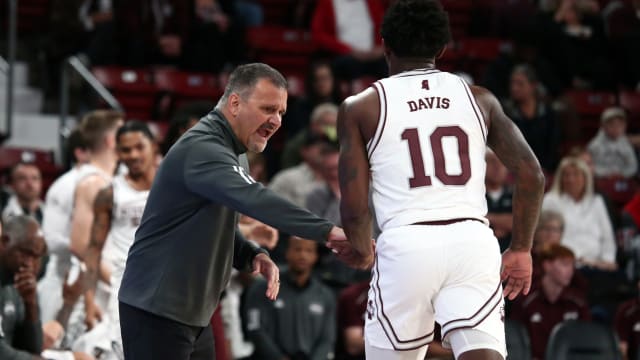 Nov 14, 2023; Starkville, Mississippi, USA; Mississippi State Bulldogs head coach Chris Jans (left) react with guard Dashawn Davis (10) as he checks out of the game during the first half against the North Alabama Lions at Humphrey Coliseum. Mandatory Credit: Petre Thomas-USA TODAY Sports